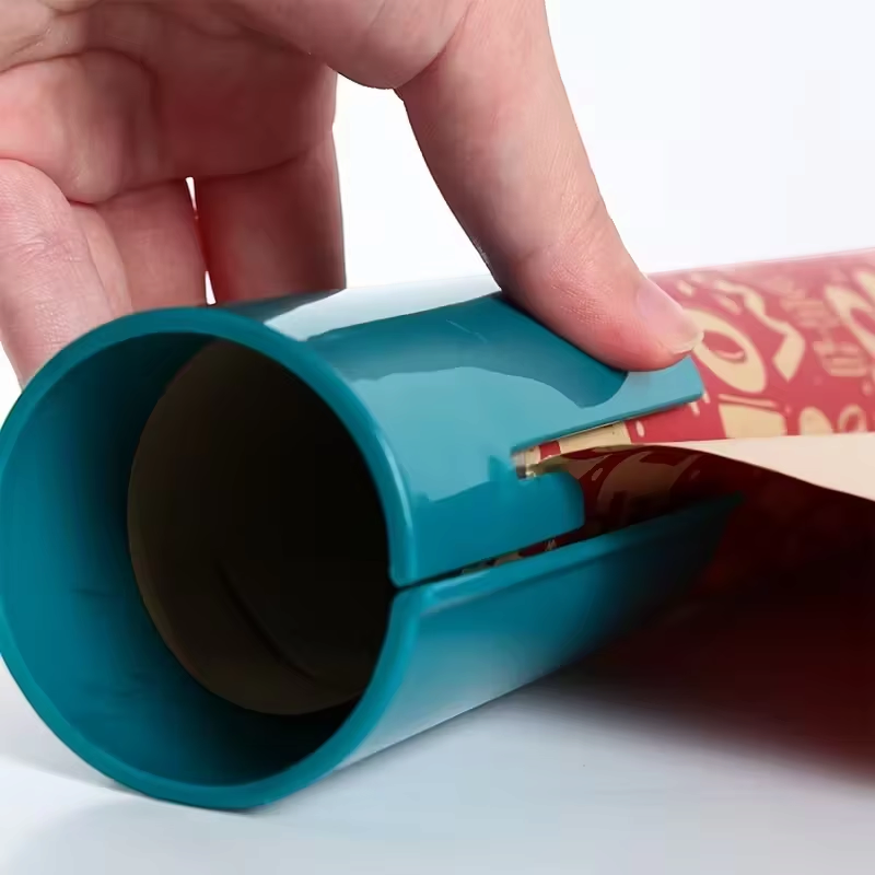 Wraptora - Ajándékcsomagoló vágó beépített pengével és rugalmas zsanérral